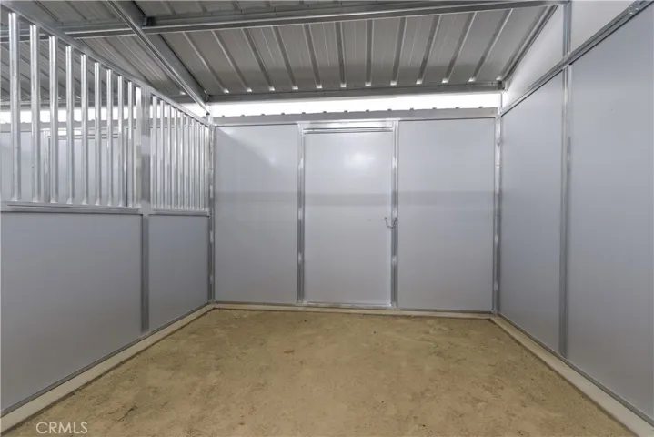 All horse stalls are comfortably sized and accessible from both ends.