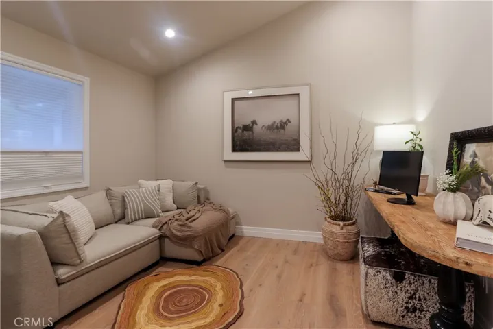The entry level flex-space is currently stage as a game or family room. It can also easily be a sixth bedroom, which would make three entry-level bedrooms.
