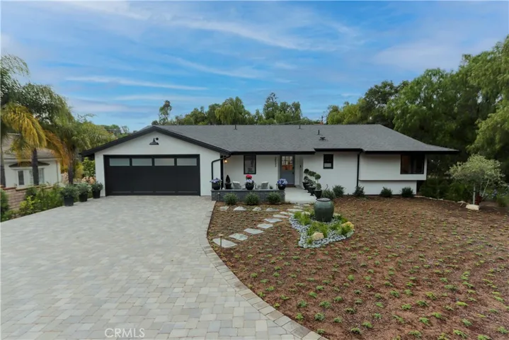 The striking exterior of this home has exceptional curb appeal complimented by professional landscaping with water feature, a welcoming front porch and expansive driveway with generous off-street parking.