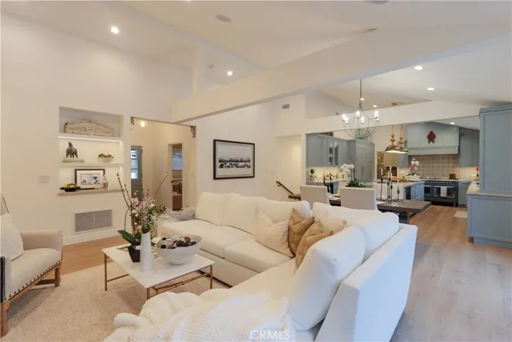 Warm and inviting, the open family-style floorplan with lighted architectural niche is perfectly suited for gatherings both large and small.