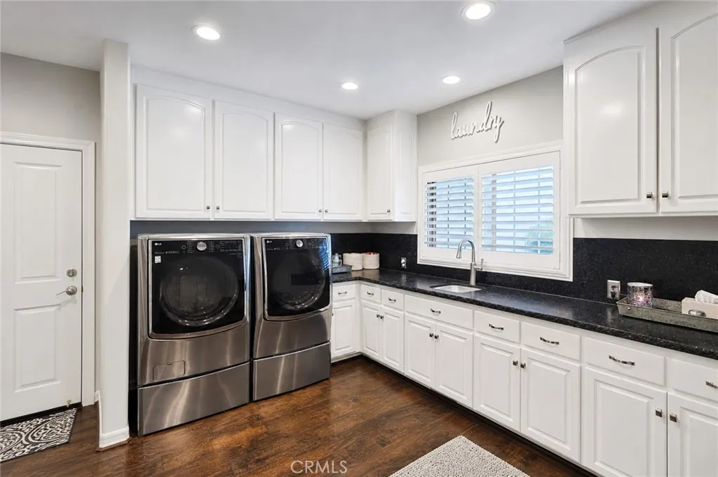 Large laundry room. 3rd bath room is to your left. Right off garage entry into laundry