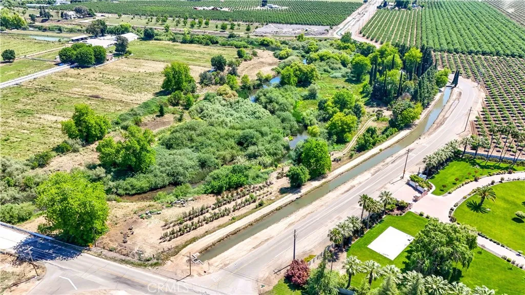 The North East corner of Arboleda Dr. and S. E. Bear Creek. First driveway on left side .