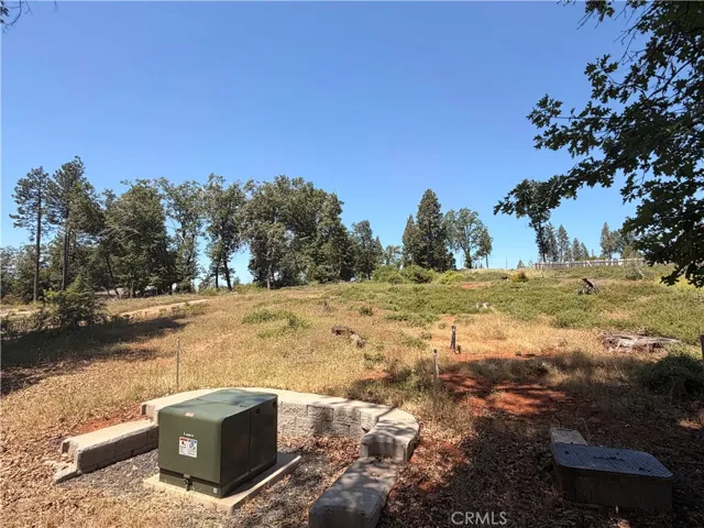 Looking up onto the property bottom right side, at the street.