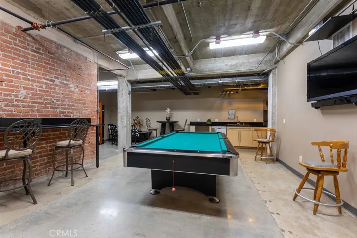 Meeting room with pool table, TV and kitchen