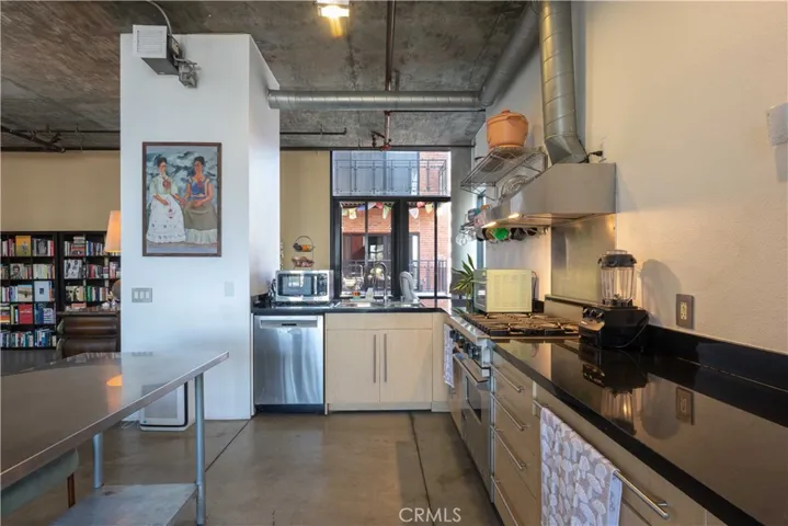 Kitchen runs along west wall