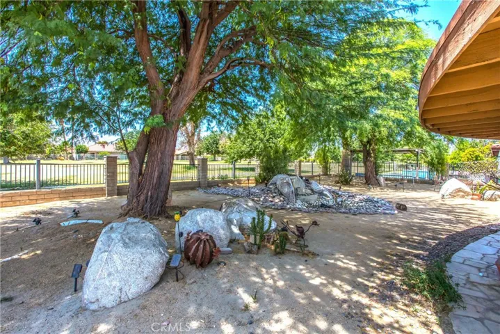 tranquil backyard scenery, with a water feature and golf course views!