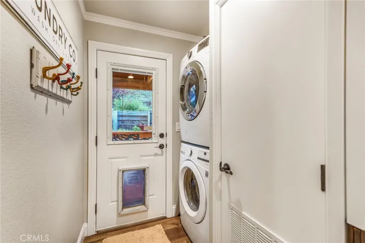 Laundry room with stackable units.
