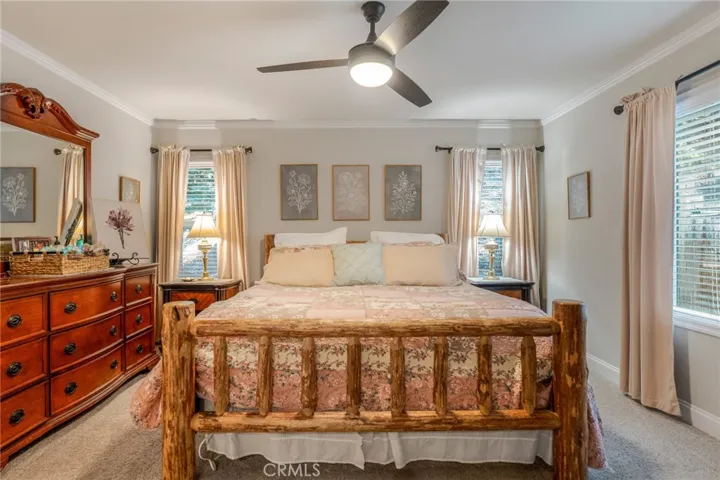 Primary bedroom with ceiling​​‌​​​​‌​​‌‌​​‌​​​‌‌​​​‌​​‌‌​​‌‌​​‌‌​​​​ fan.