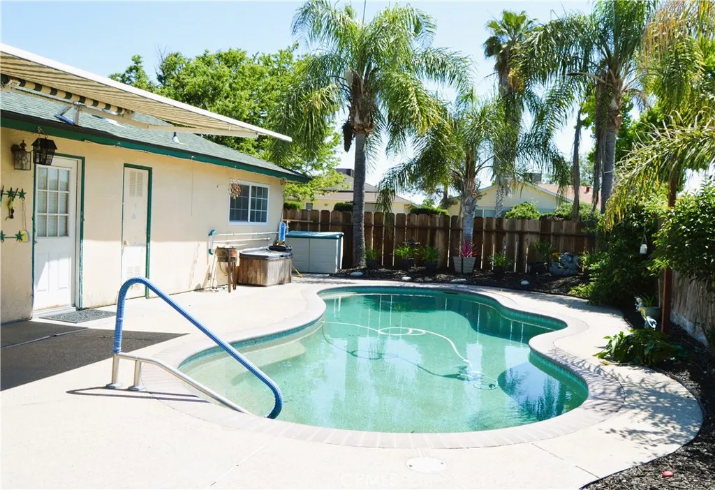 Remote control operated retractable awning extending out towards the refreshing pool