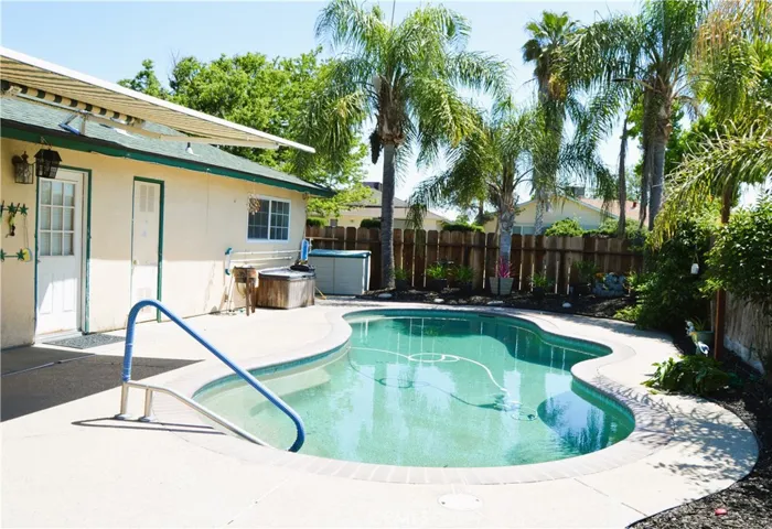 Remote control operated retractable awning extending out towards the refreshing pool