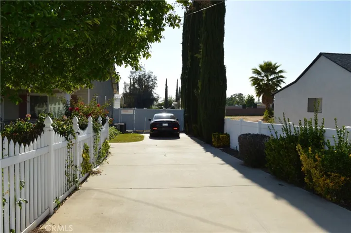 2nd driveway with double gates to back yard