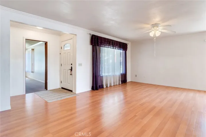 Front entry is set back from street and accesses in to the main living spaces, adjacent the bonus room.