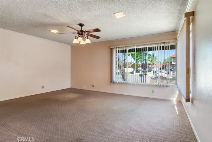 Bonus room with large windows at ront of house.