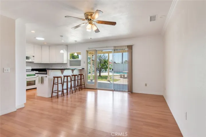 View from hallway towards kitchen and backyard.