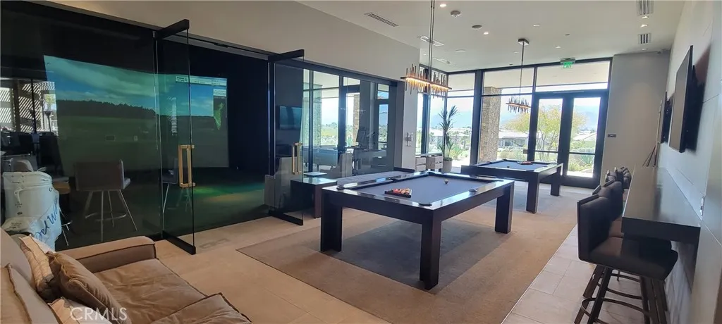Golf simulator and pool at the Clubhouse across the street.