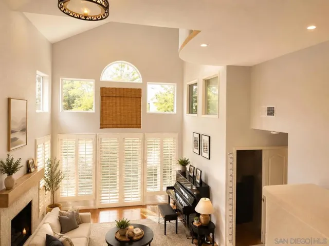 Spacious and bright with a high ceiling and multiple windows.