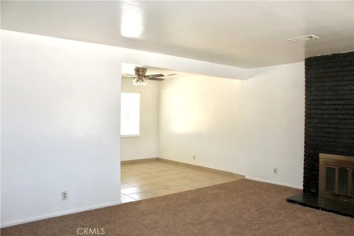 Living room with brick fireplace