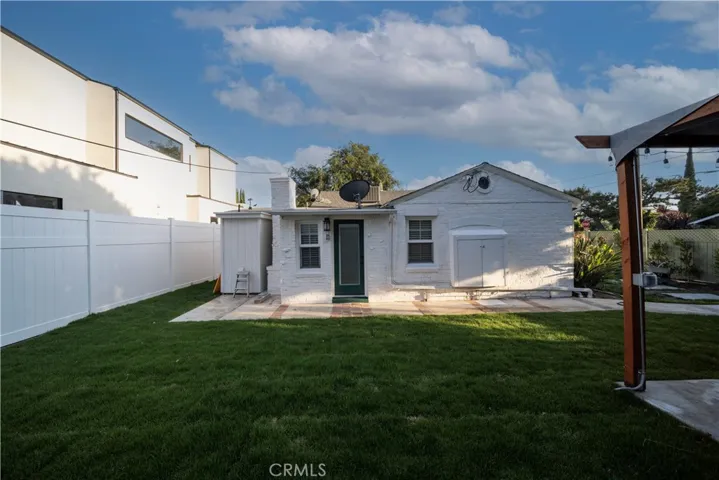 View of rear of home from new lawn