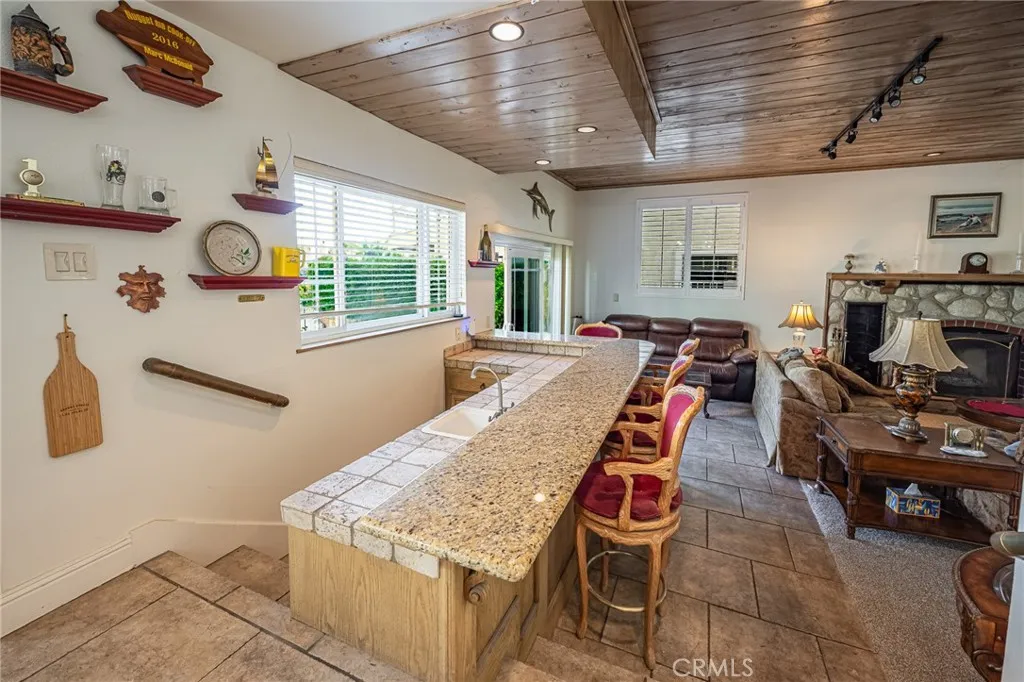 Granite Counter Bar off Living Room- convenient for entertaining