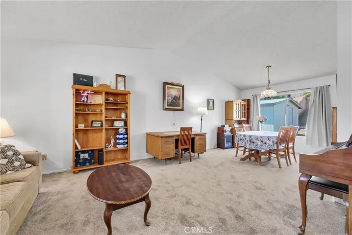 Living Room features Vaulted Ceilings