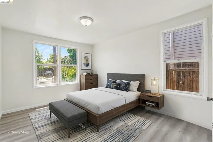 Bright interior space featuring light wood-finish flooring and white walls