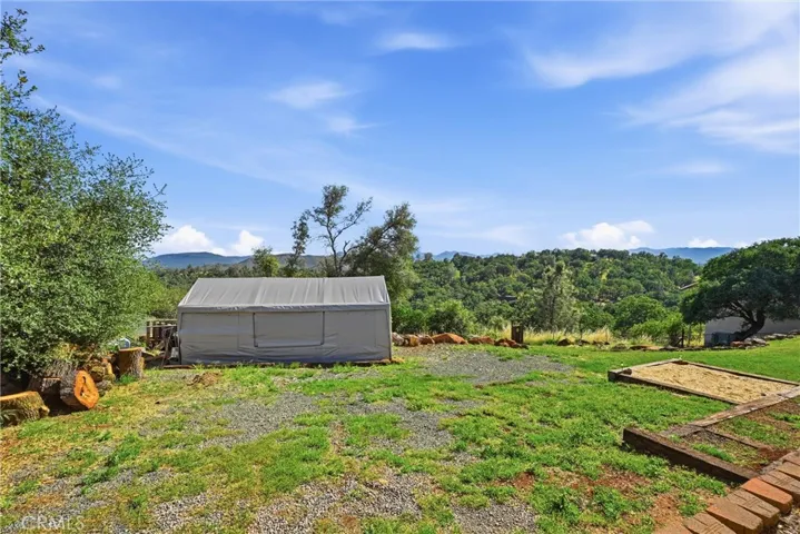 Wood storage area at rear of property.