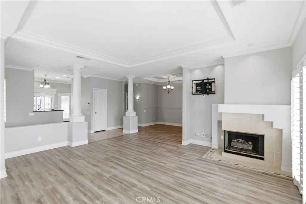 View into entry, kitchen and dining area from living room