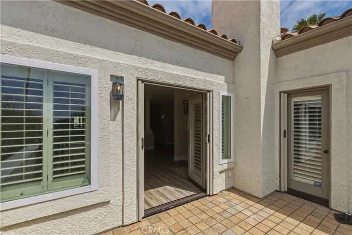 Front balcony off of living room and primary bedroom