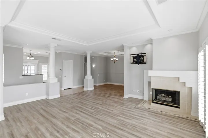 View into entry, kitchen and dining area from living room