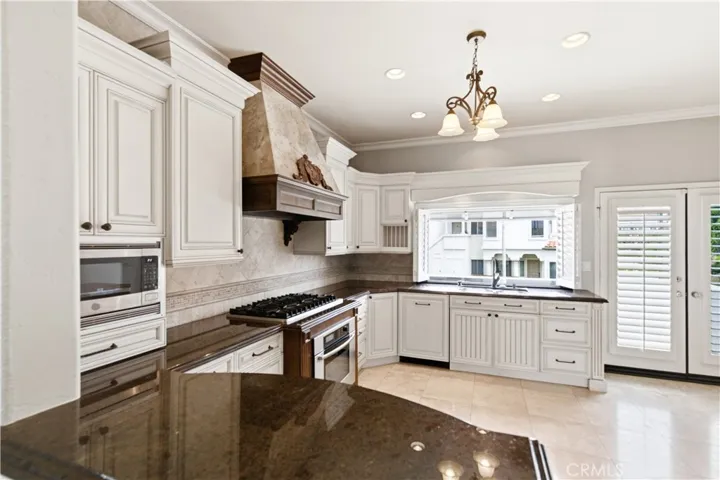 View into kitchen from front entry way
