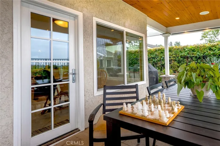 The patio has a covered dining area directly off the kitchen
