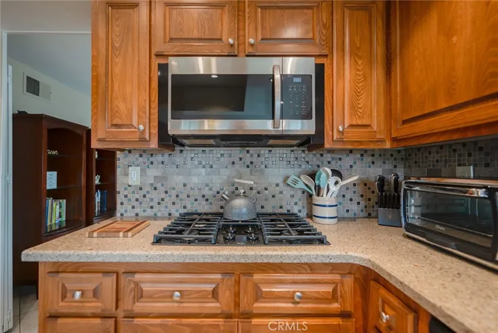 Look at how gorgeous the tile backsplash and cabinets are!