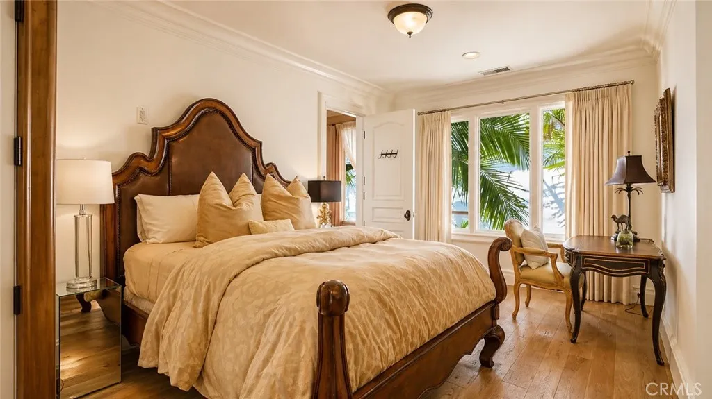 Bedroom 3 with wood flooring.