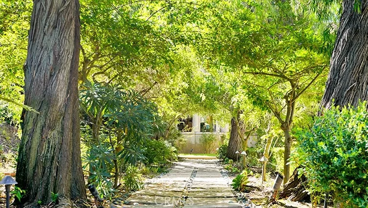 Walkway to the front door...very private, through trees. Home is set back from the street.