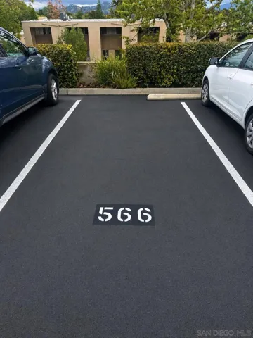 One deeded parking space (#566) is included with the unit. Residents and guests may obtain additional overnight guest parking permits through the HOA’s online portal.