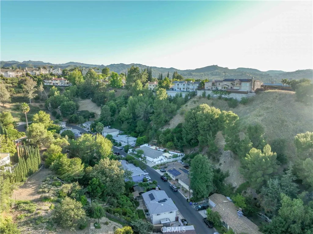 Drone aerial view of 4772 Excelente Drive and surrounding neighborhood.