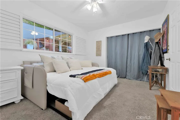 Third bedroom at 4772 Excelente Drive shown in its existing layout with a large window.