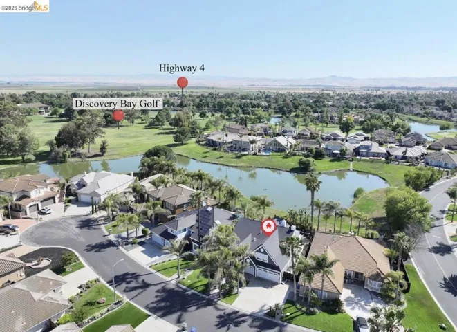 Aerial perspective showcasing a residential community with numerous homes