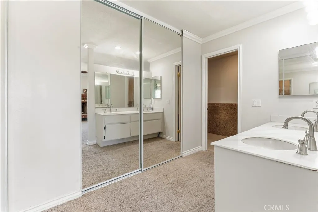 Primary Bathroom -Dual Sinks and Mirrored Wardrobe Doors