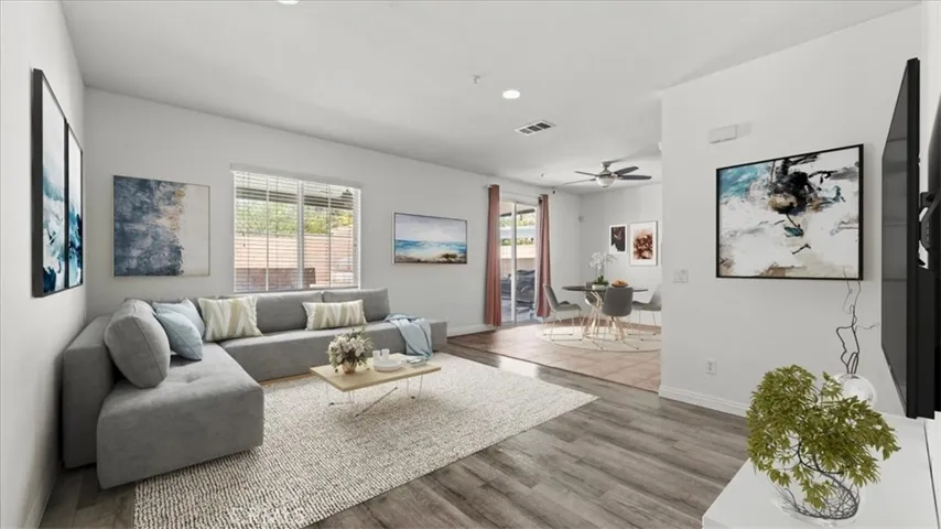 Family room and dining room are virtually staged.