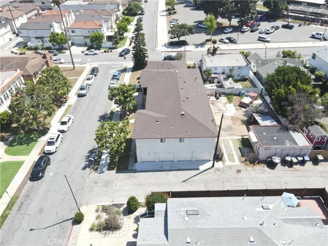 Rear of property off alley with four one-car garage.