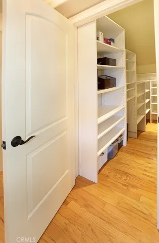 Downstairs Closet Under Stairs.