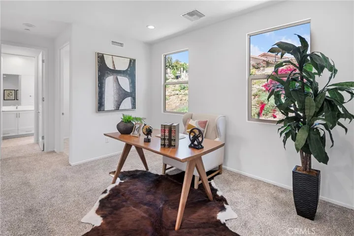 “Photos shown are from a similar/model unit for staging reference only. Actual unit layout, finishes, and features may vary.”