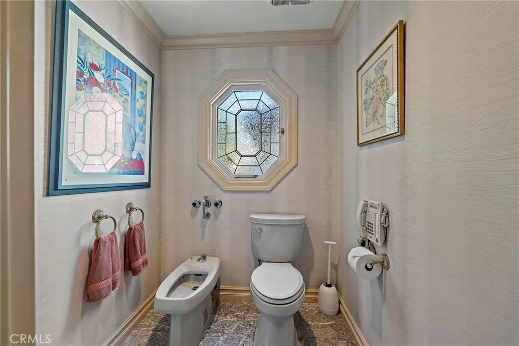 Separate commode/bidet room in primary bathroom.