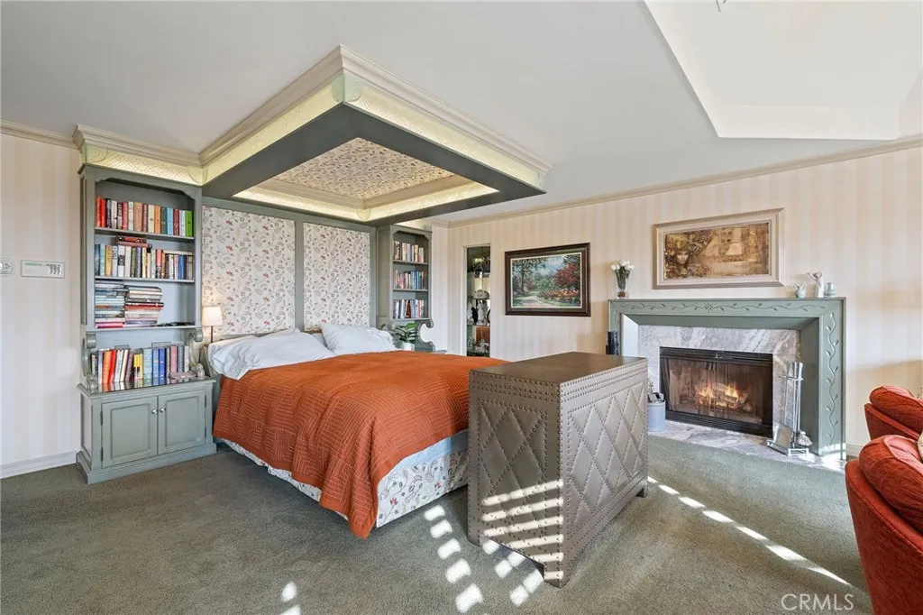 Stunning Royal-like primary suite built-ins and a custom fireplace.
