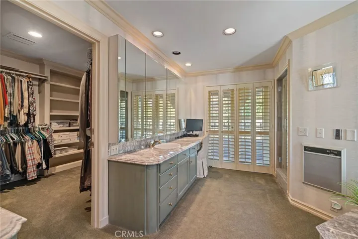 Hige walk-in closet with built-ins.