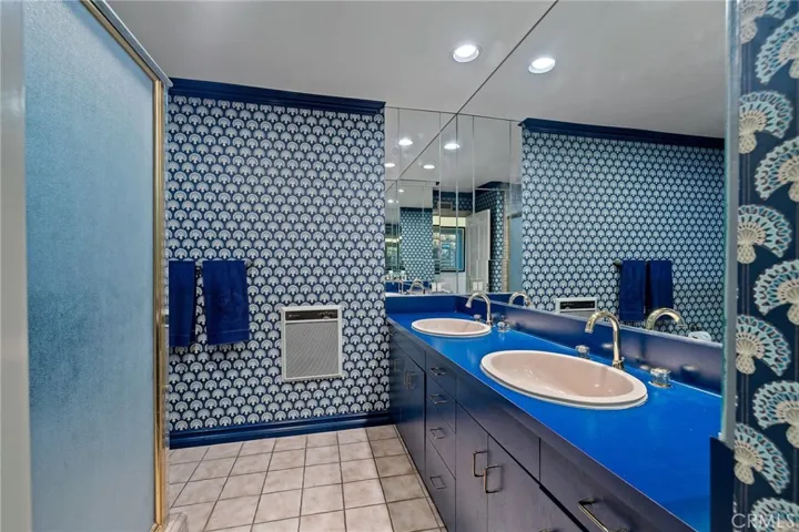 Upstairs bathroom with two sinks.
