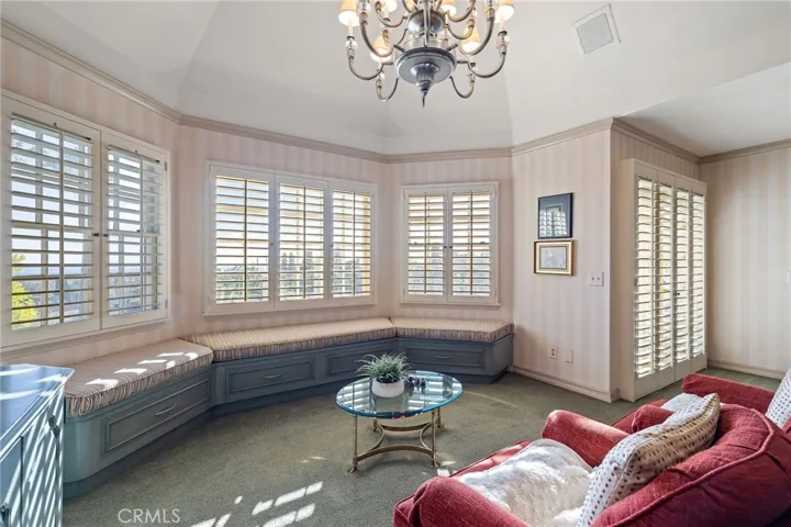 Primary suite French doors lead to a lovely balcony.