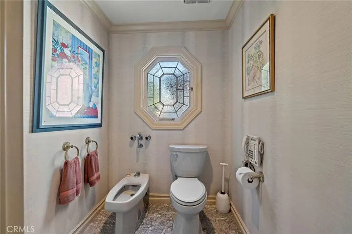 Separate commode/bidet room in primary bathroom.