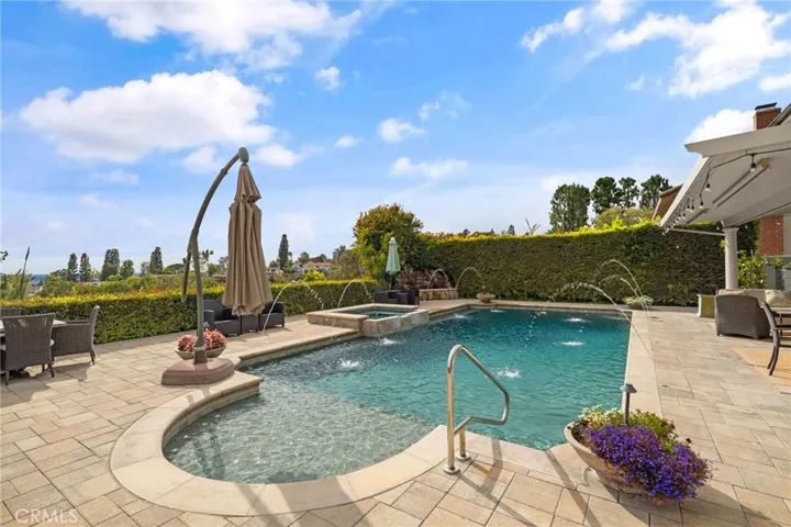 Beautiful pool/spa with pebble rock bottom.